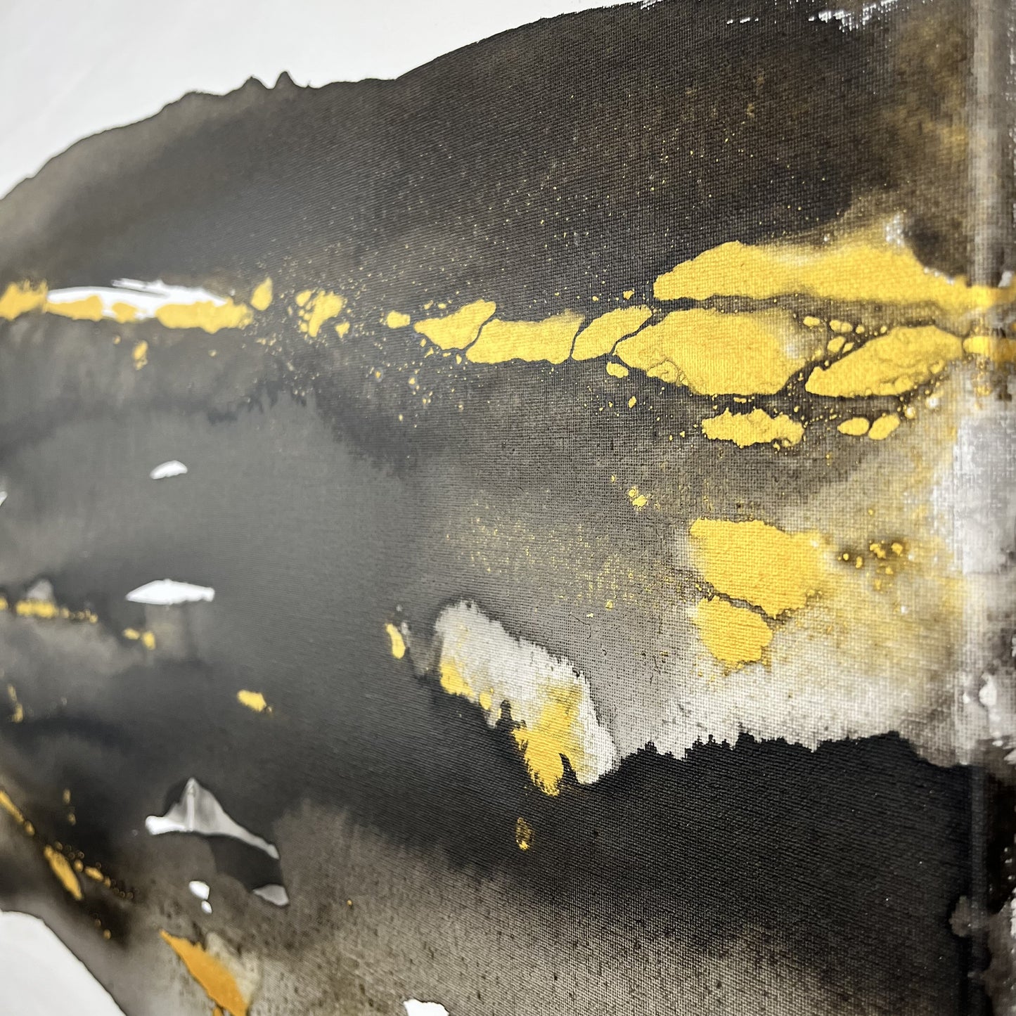 Abstract painting in black, white, and gold tones inspired by the movement and hidden elements of the earth, Earth’s Whisper II by Charlotte George.