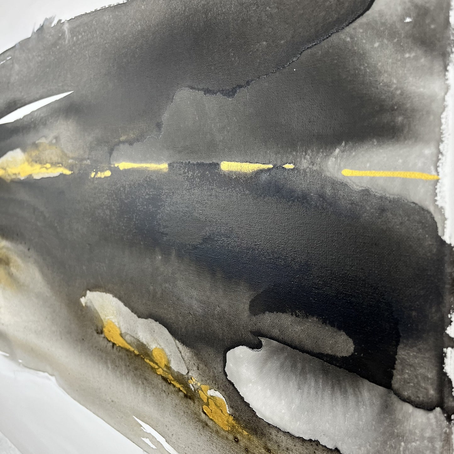 Abstract black, white, and gold painting depicting the earth’s movement and buried elements, Earth’s Whisper I by Charlotte George.