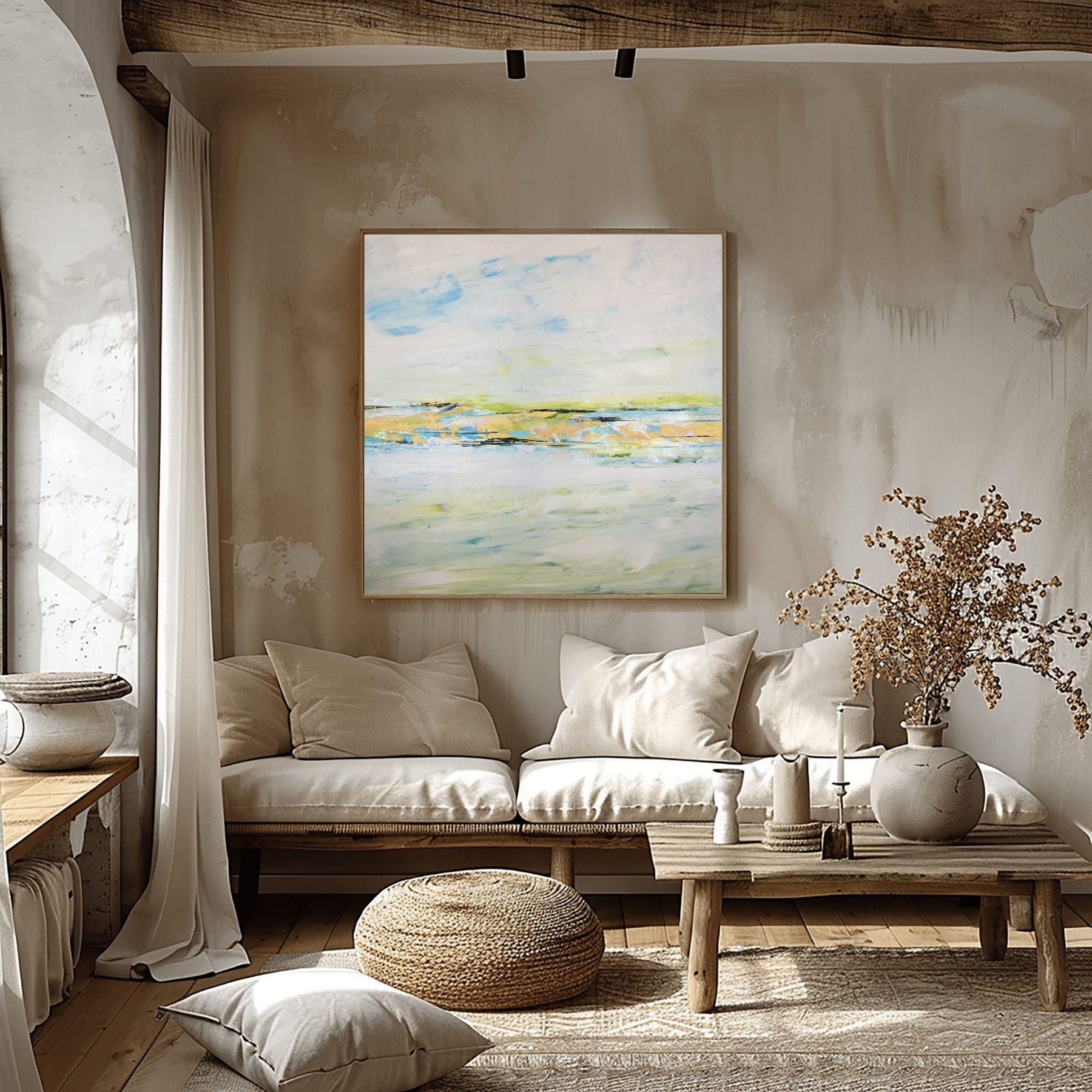 Charlotte George soft abstract landscape painting in pale blues and gold, framed in a sunlit room