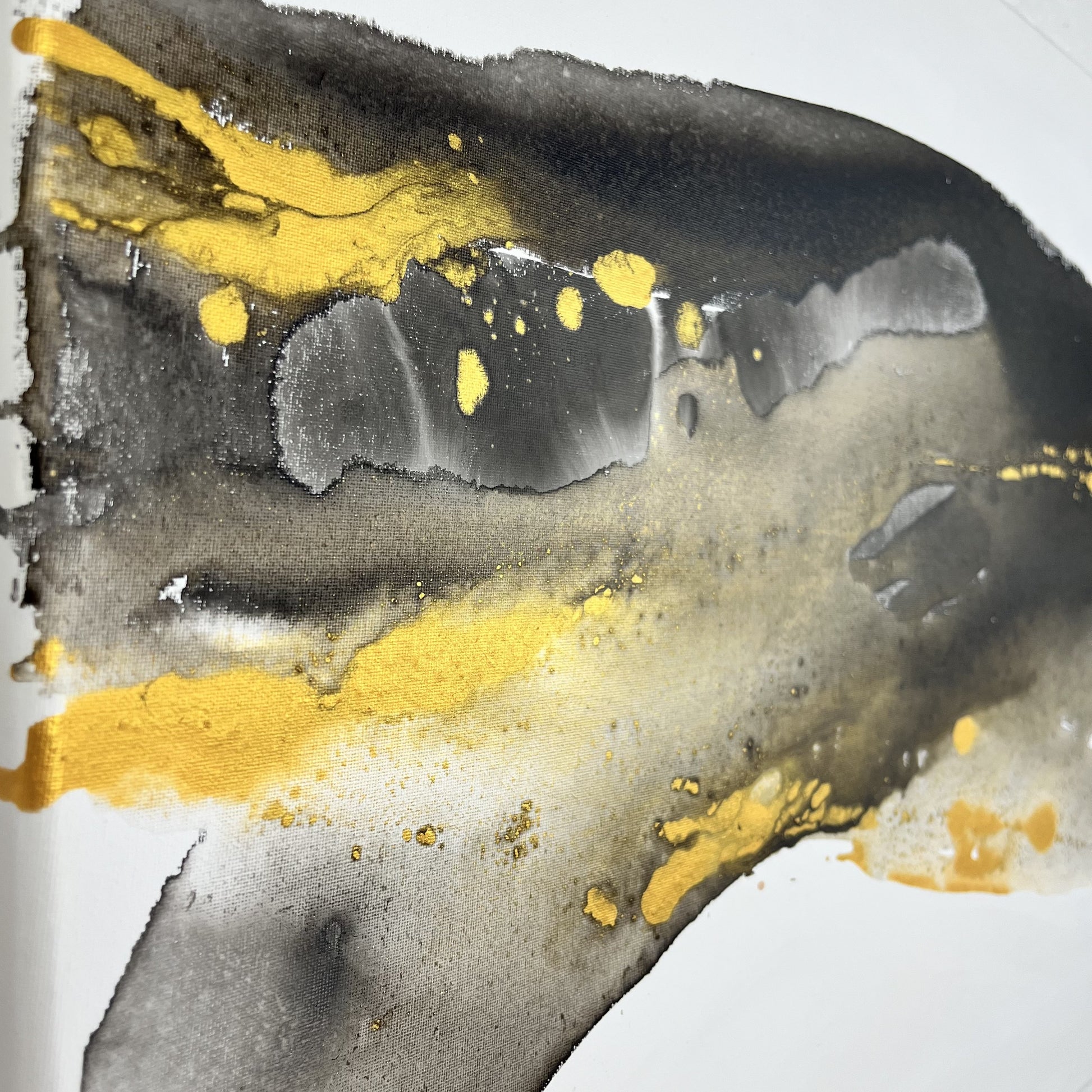 Abstract painting in black, gray, and gold tones by Charlotte George, Earth’s Whisper IV, expressing the molten energy and stillness of the earth.