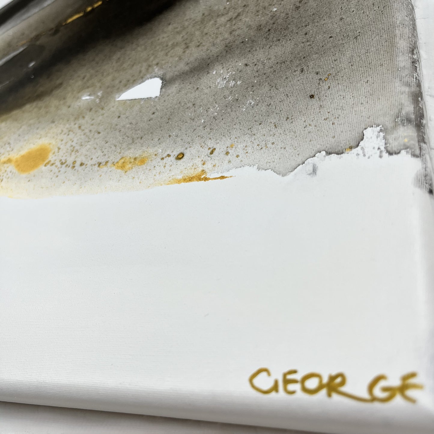 Abstract painting in black, gray, and gold tones by Charlotte George, Earth’s Whisper IV, expressing the molten energy and stillness of the earth.