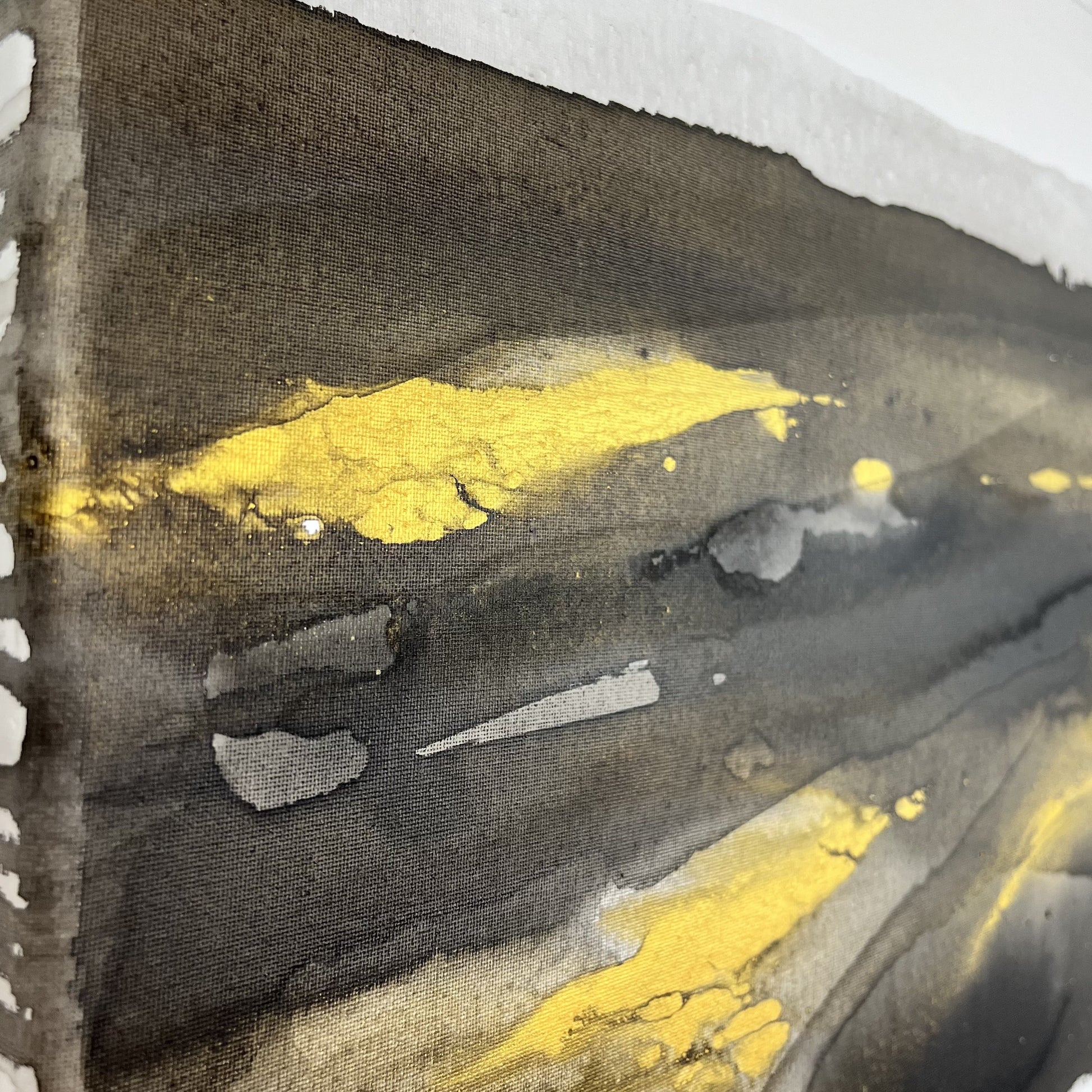 Abstract painting in black, gray, and gold by Charlotte George, Earth’s Whisper VI, evoking balance, renewal, and the subtle energy of the earth’s final whisper