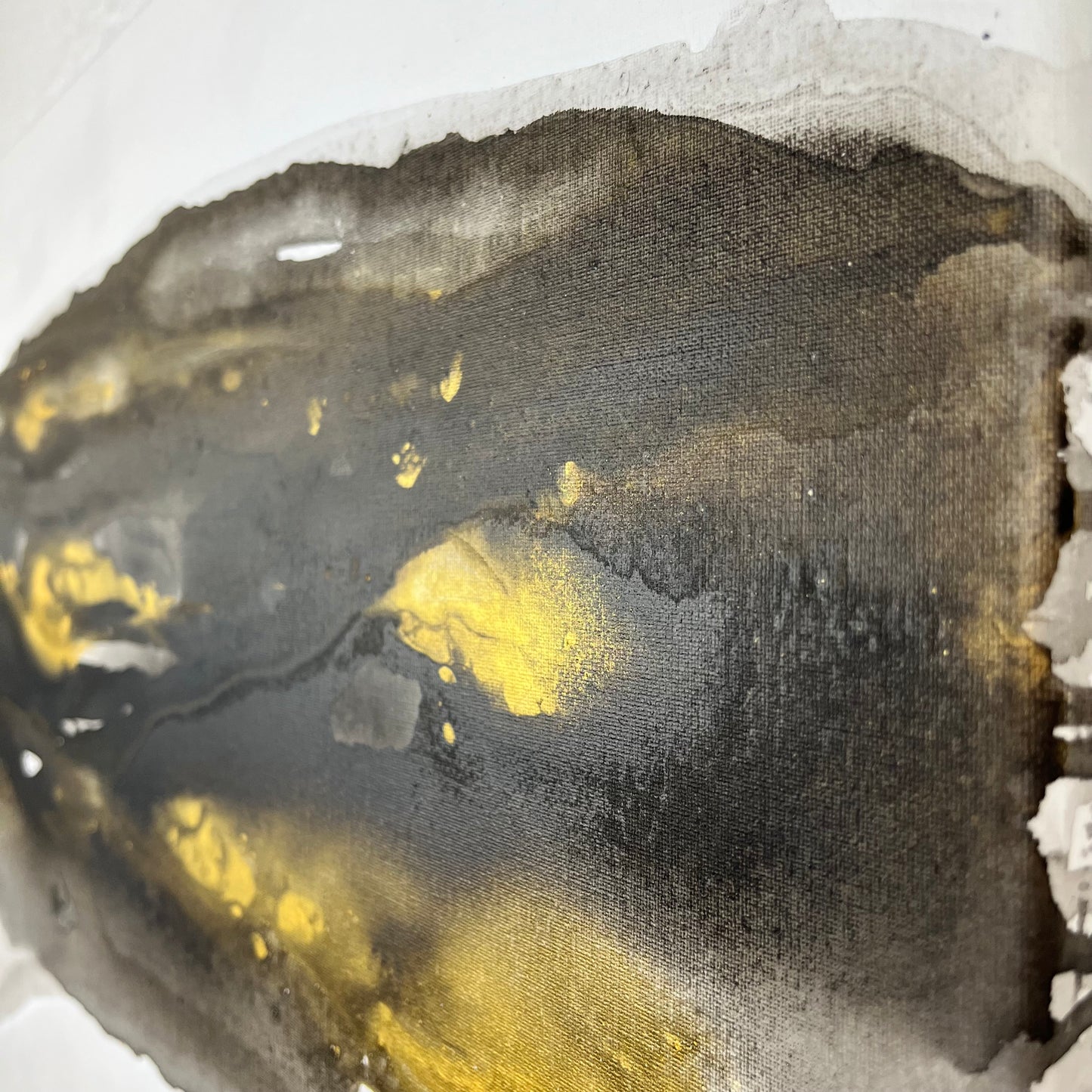 Abstract painting in black, gray, and gold tones by Charlotte George, Earth’s Whisper V, evoking the shifting movement and subtle radiance of the natural world