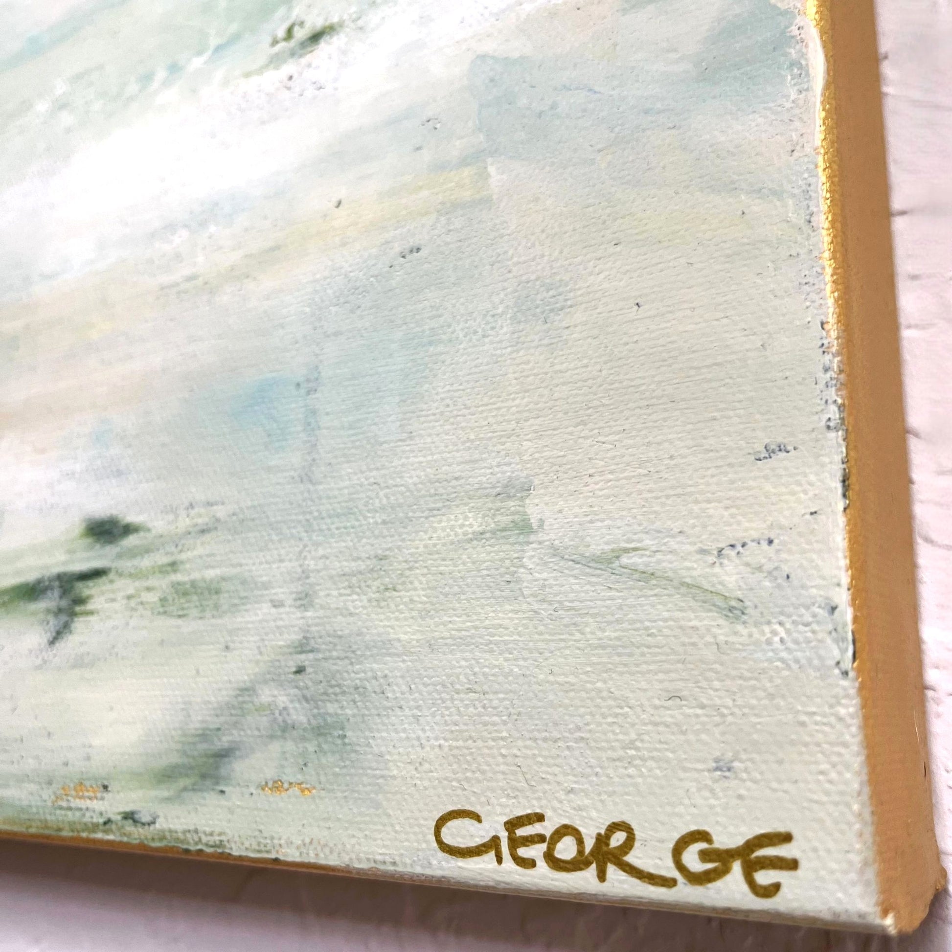 Calm abstract landscape in natural hues of green, beige, and slate blue by Charlotte George, evoking the movement of water and land
