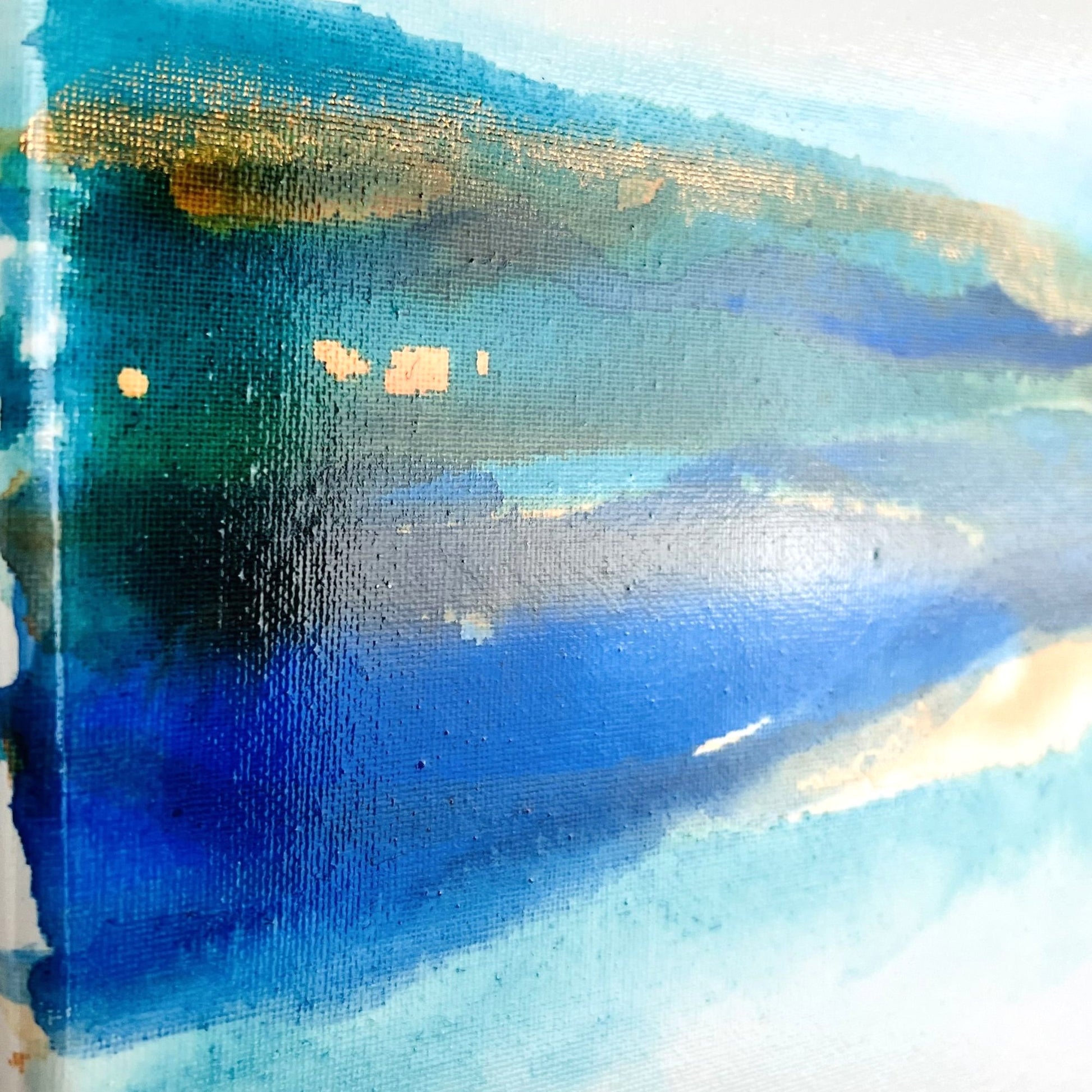 Abstract painting with soft layers of turquoise, brown, and blue ink flowing across a light canvas