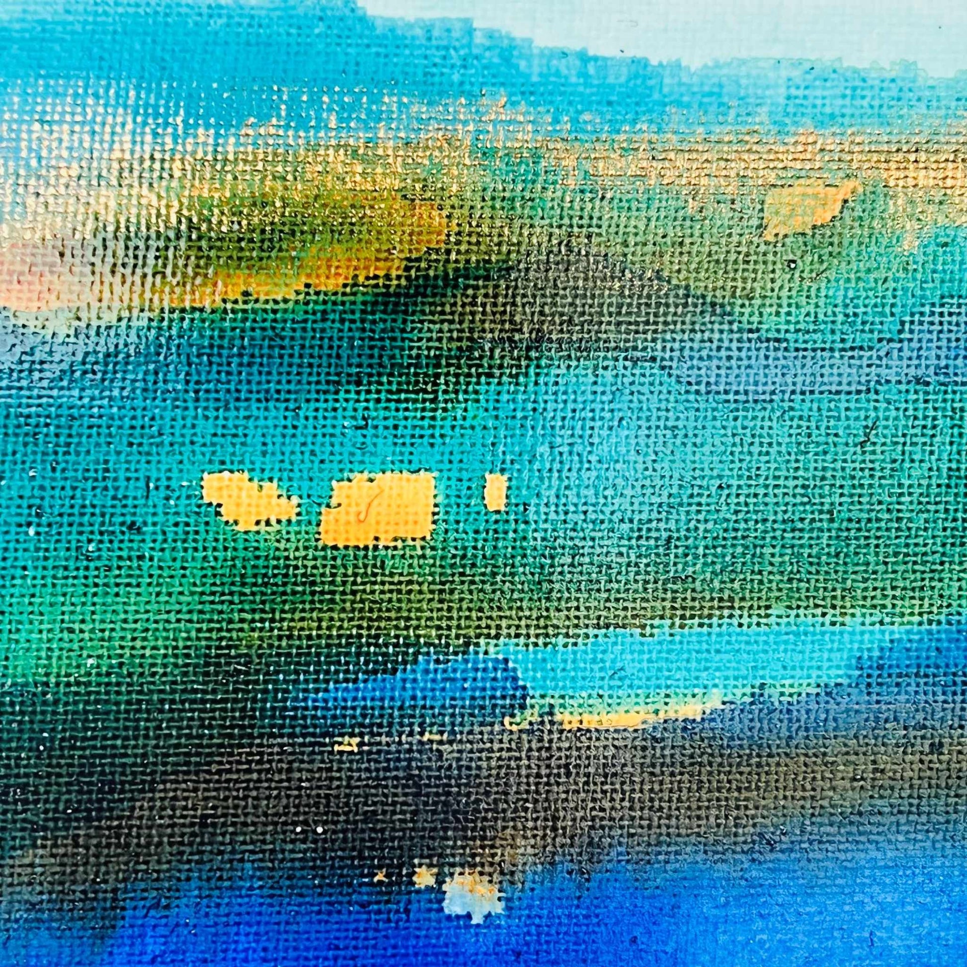 Abstract painting with soft layers of turquoise, brown, and blue ink flowing across a light canvas