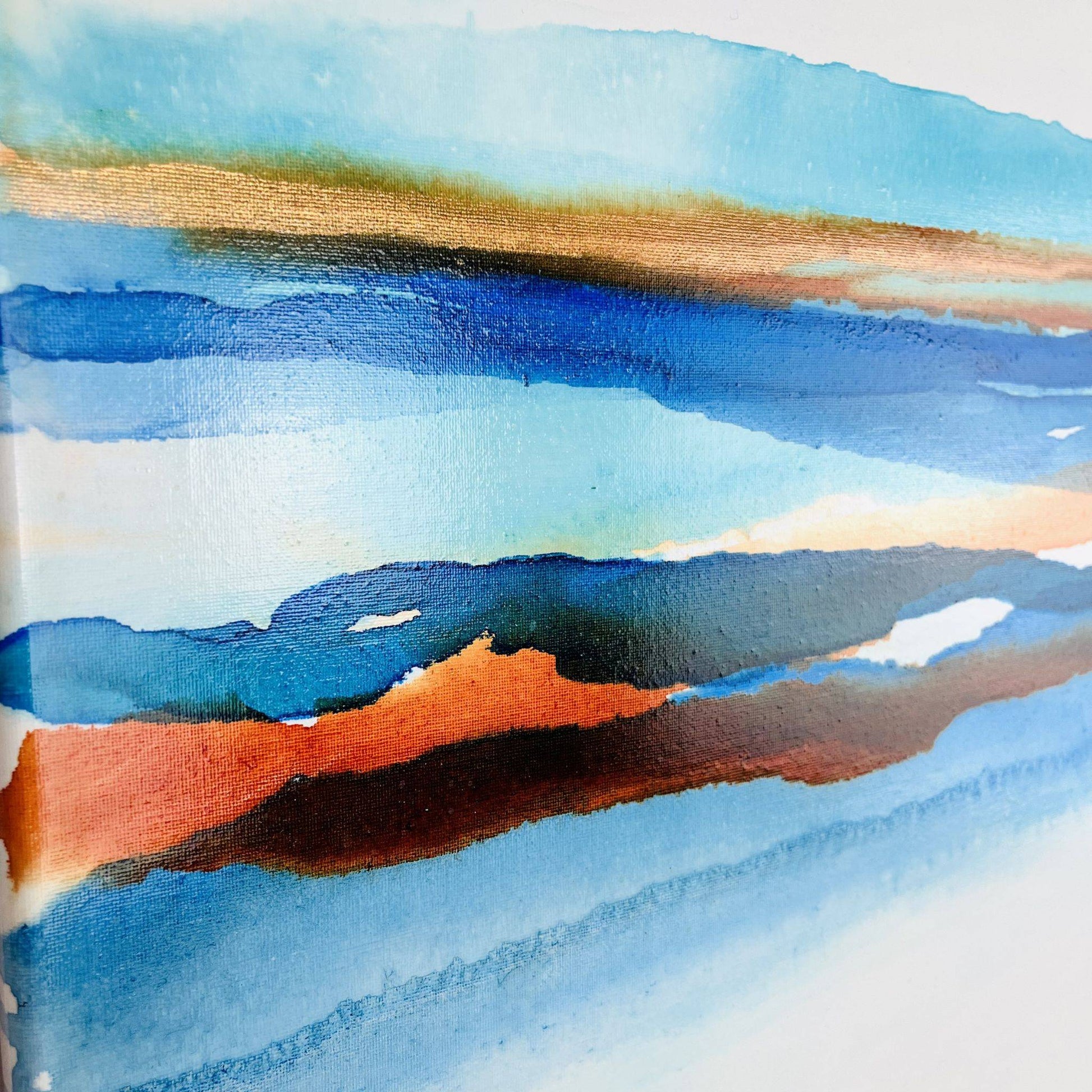 Contemporary abstract painting with layered blue, green, and warm tones forming a coastal-inspired ink landscape