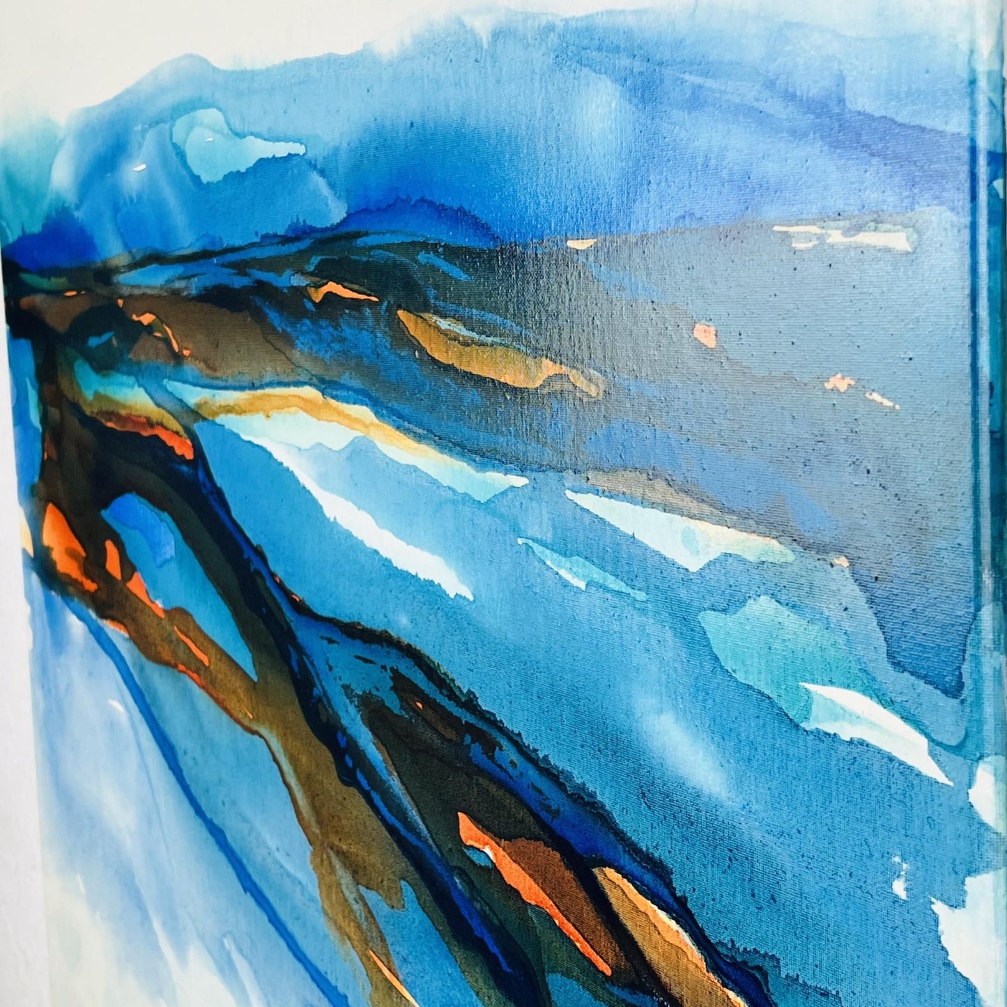Abstract coastal painting in blue and amber ink by Charlotte George Artist, evoking the movement of low tide