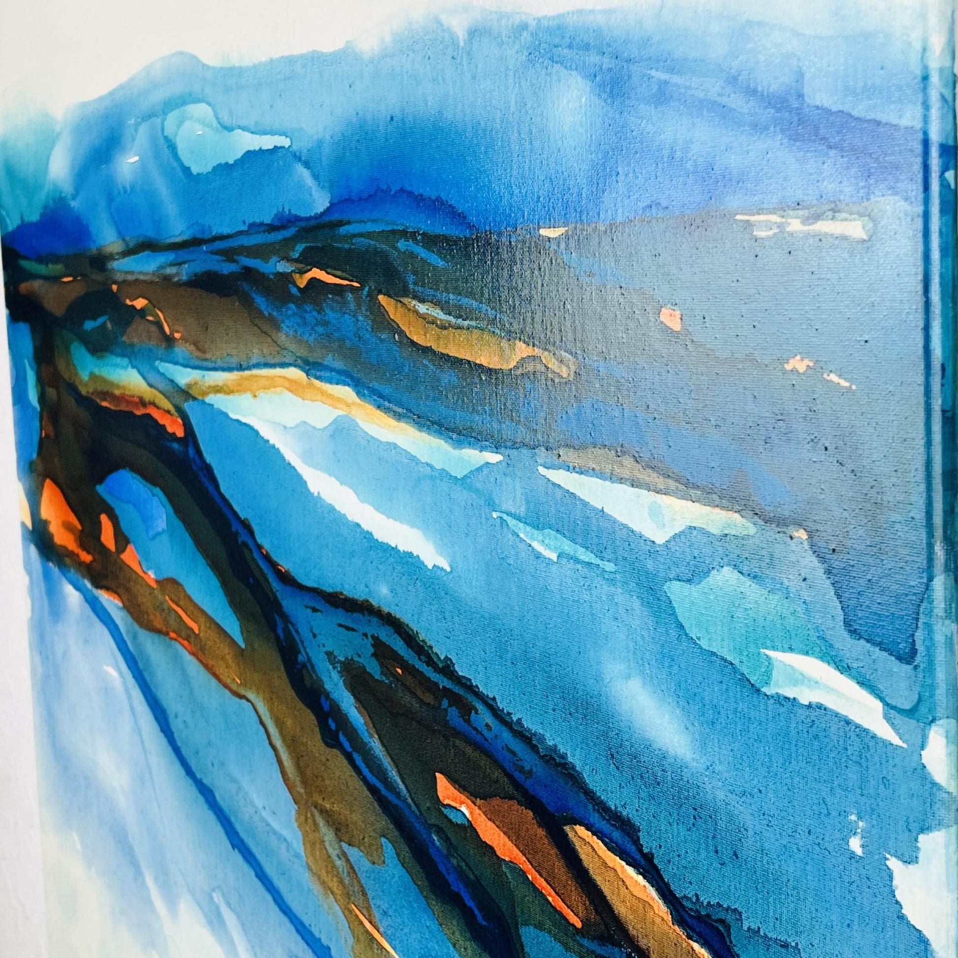 Abstract coastal painting in blue and amber ink by Charlotte George Artist, evoking the movement of low tide