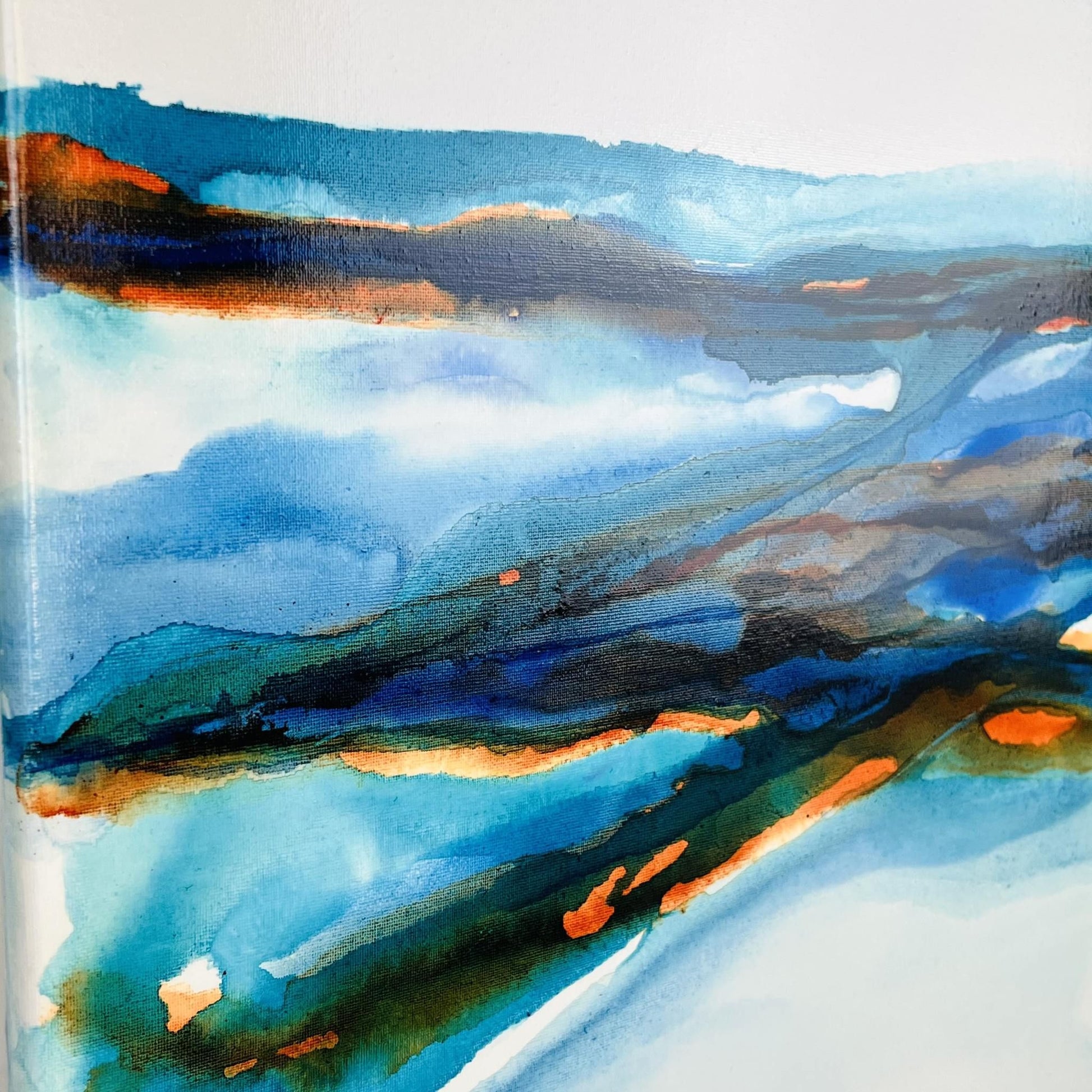 Calming abstract ink artwork with soft blues and whites, reflecting coastal light and sky on canvas
